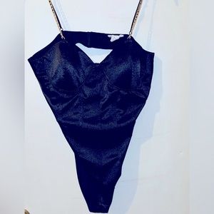 Woman’s body suit.
